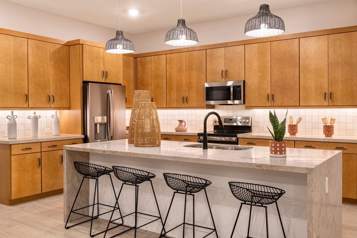 Modern home kitchen with waterfall edge island